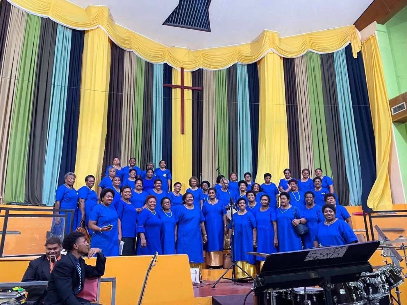 Mount Zion Cathedral choir in blue gathered on stage