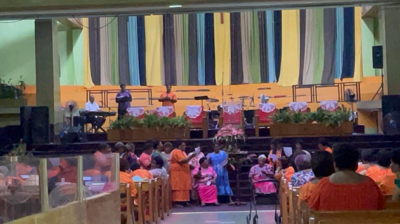 Church members gathered in fellowship inside Mount Zion Cathedral